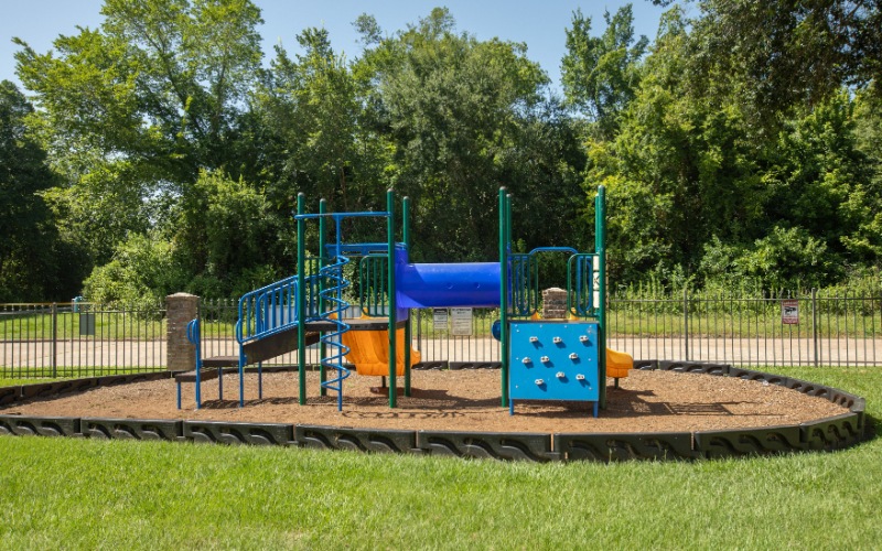 playground equipment with trees in background